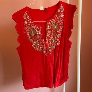 Red tank with embroidery.